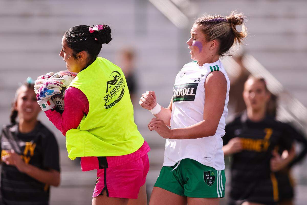 Southlake Carroll midfielder Audrey Anderson (5) holds herself back from the Forney goalkeeper who catches the ball in a UIL Class 6A Division 2 girls soccer state semifinal on Saturday, April 4, 2026, at Memorial Stadium in Mesquite, Texas.