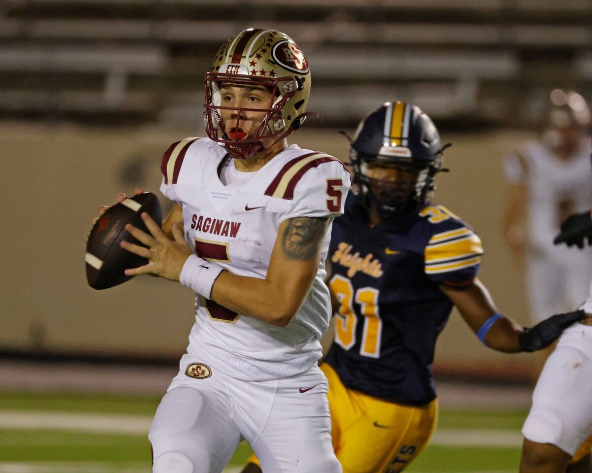 Saginaw quarterback Roman Morales (5) rolls out and throws a completion during a District 4-5A D1 football game at Farrington Field in Fort Worth, Texas, Thursday, Oct. 10, 2024. (Special to the Star-Telegram / Bob Booth)