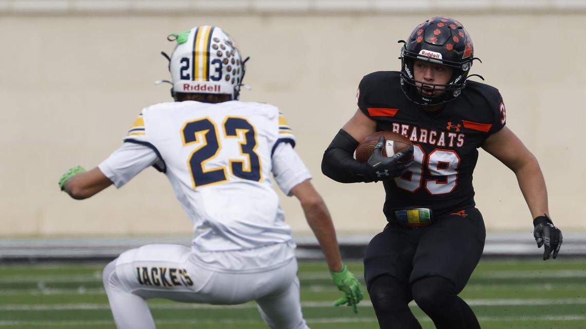 Fort Worth Arlington Heights defensive back Diesel Payne (23) zeros in on Aledo running back Brady Powell (39) during the first half of a UIL Class 5A Division I Regional on Friday Nov. 28, 2025 at Crowley ISD Multi-Purpose Stadium in Fort Worth, Texas.
