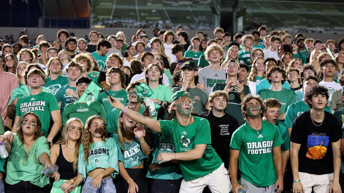 Dragon fans cheer on their team in the first half of an UIL football game at Dragon Stadium in Southlake, Texas, Friday Aug. 25, 2023.