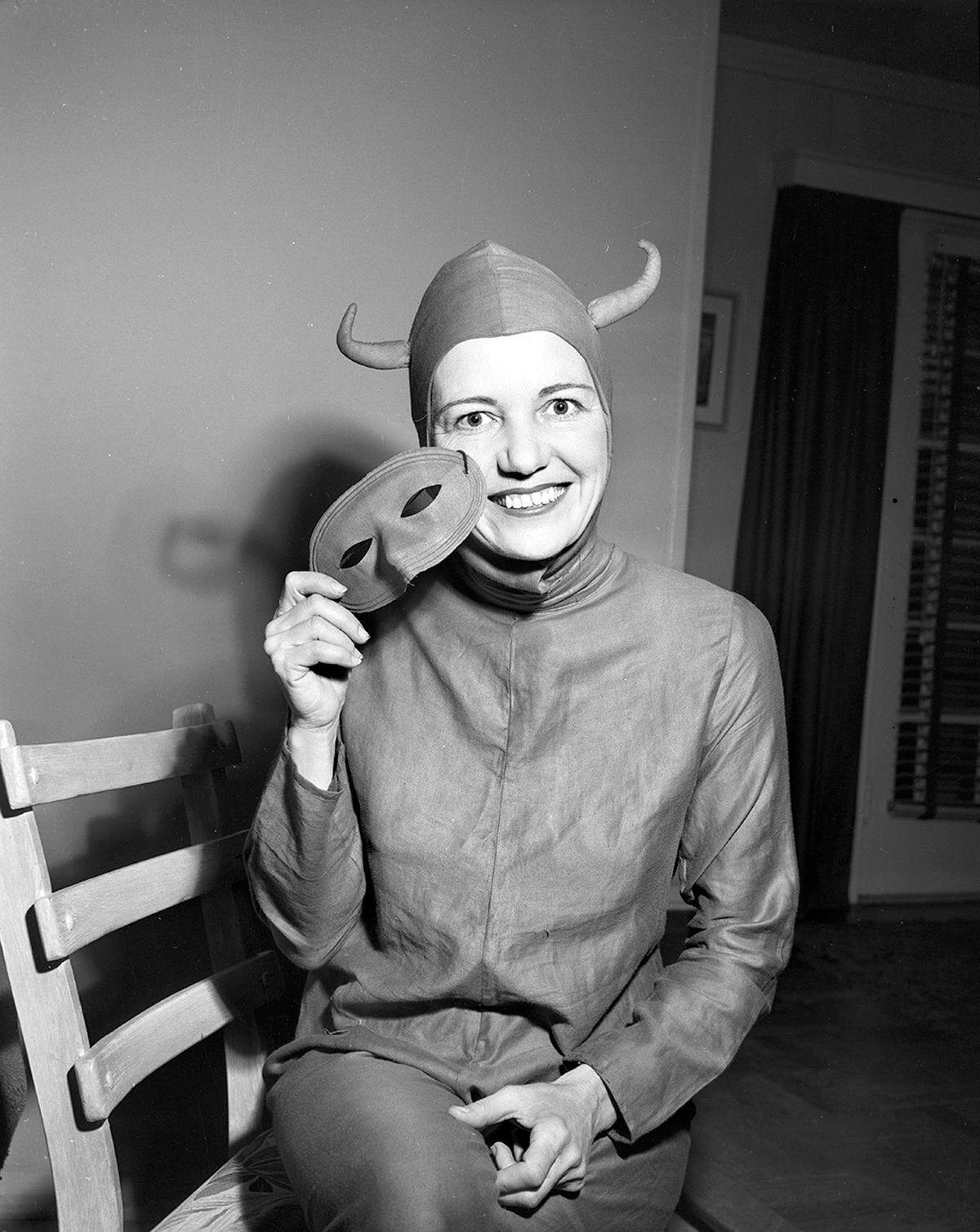 1952: Mrs. Homer Belew went out spooking on Halloween night wearing for the 30th year the same devil’s costume her mother made for her when she was a girl.