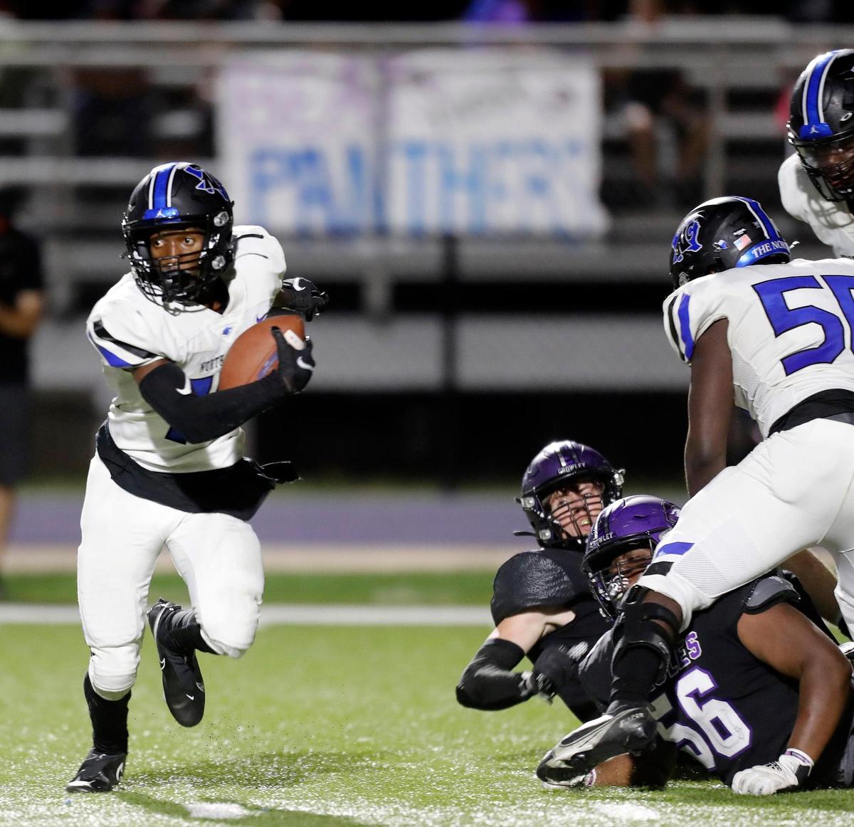 North Crowley quarterback Quinton Jackson (10) gets out of trouble in the backfield and looks for room downfield during a high school football game at Eagle Stadium in Crowley, Texas, Friday, Aug 27, 2021. North Crowley defeated Crowley 33-7. (Special to the Star-Telegram Bob Booth)