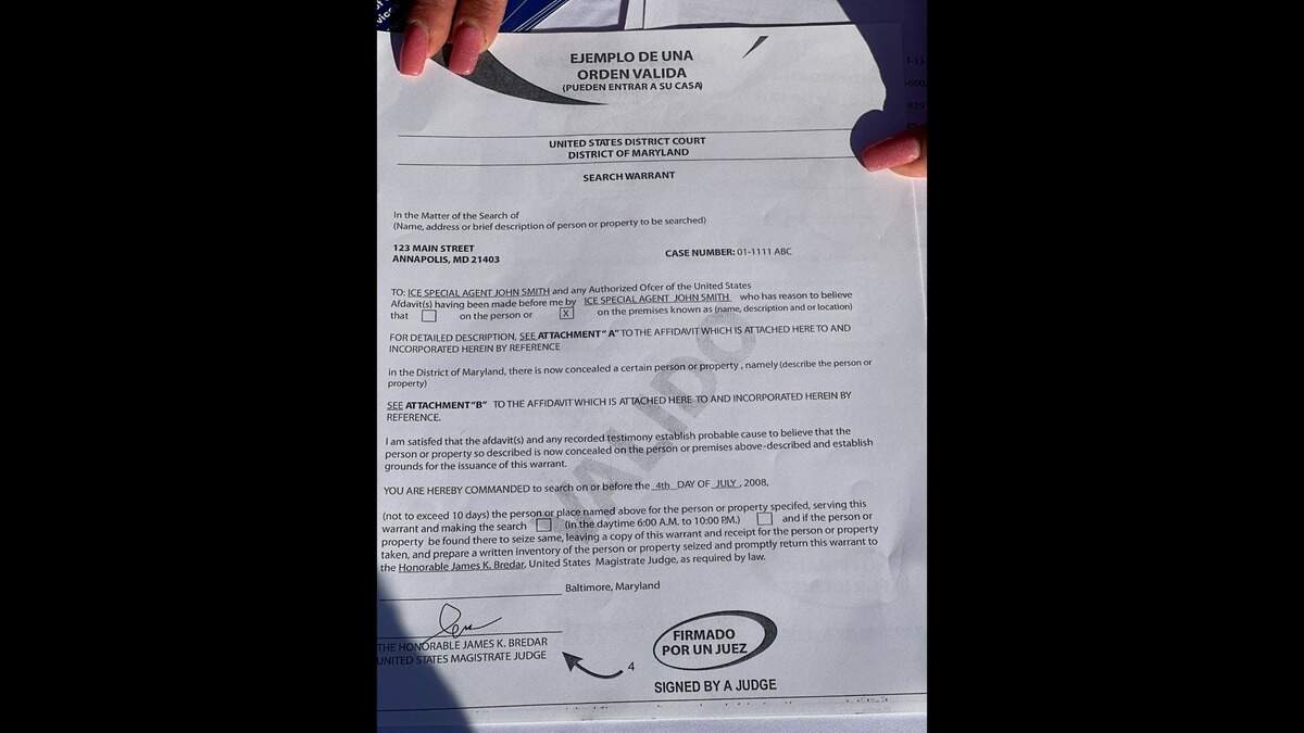 A template displayed at a community event that Congressman Marc Veasey held for Fort Worth residents shows what a search warrant signed by a judge looks like.