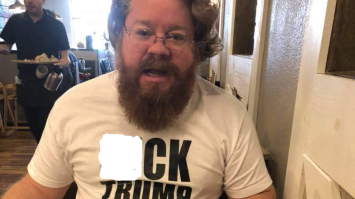 Andy Ternay tests the limits of free speech Sunday at a Richardson restaurant.