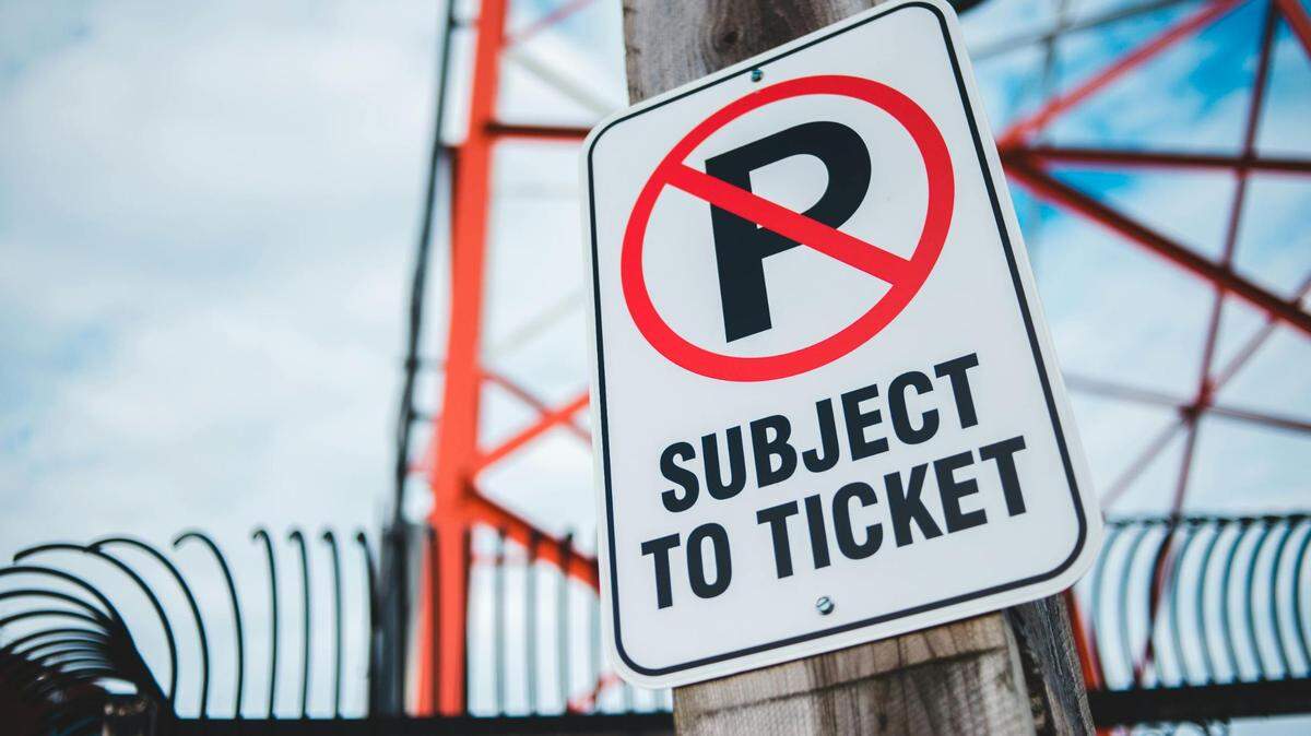 Signs like this that are visible from the parking spot means it is prohibited to park in that space. Avoid a ticket by moving somewhere else.
