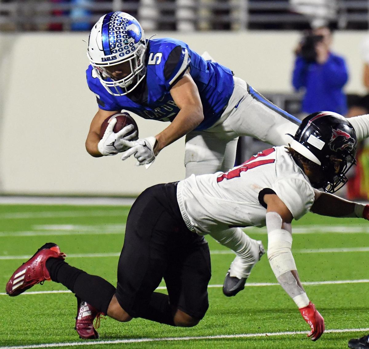 Decatur’s Devin James, left, tries to get over Wichita Falls’ Ivy Kelley as he rushes for a first down in the fourth quarter of Friday’s December 2, 2022 4A Division 1 state quarterfinal football game at the Collins Athletic Complex in Denton, Texas. Decatur won 35-21. Special/Bob Haynes
