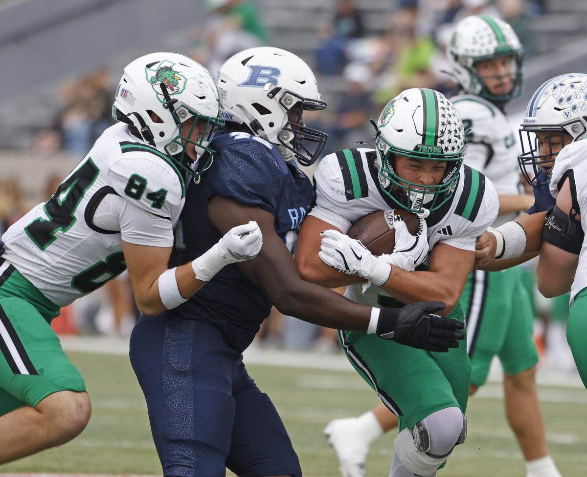 Southlake Carroll running back Davis Penn (3) is brought down at the line during the first half against Hurst L.D. Bell at Pennington Field in Bedford, Texas, on Friday, Oct. 24, 2025.