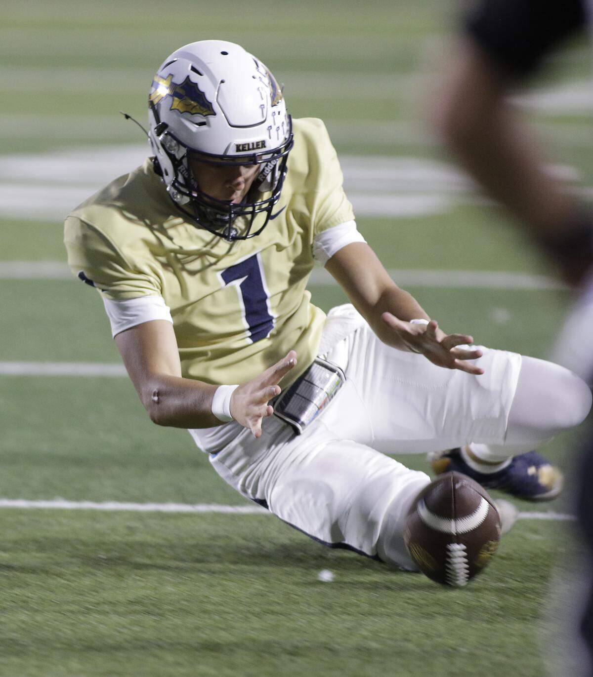 Keller’s Connick Whitmire recovers a fumble on a kickoff against Euless Trinity during their game on Friday, October 17, 2025 at Pennington Field in Bedford, Texas.
