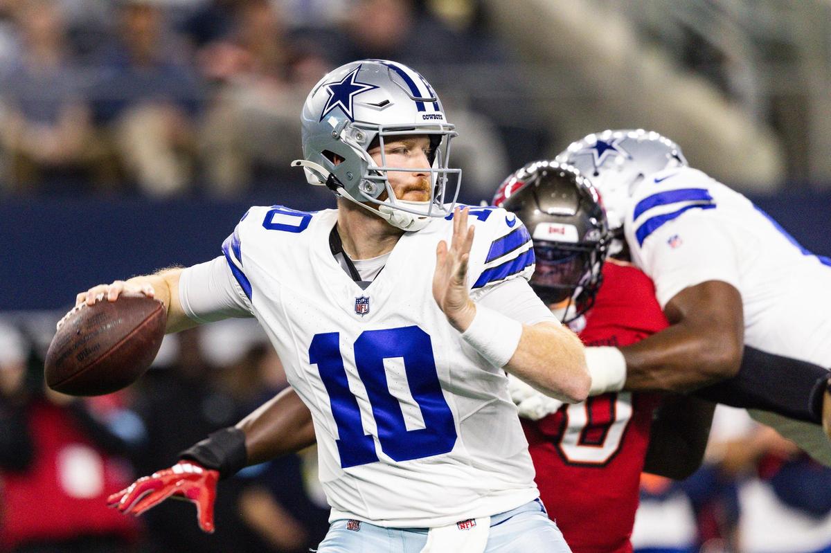 Cowboys quarterback Cooper Rush (10) throws a pass in the first half of an NFL game between the Dallas Cowboys and the Tampa Bay Buccaneers at AT&T Stadium in Arlington on Sunday, Dec. 22, 2024.