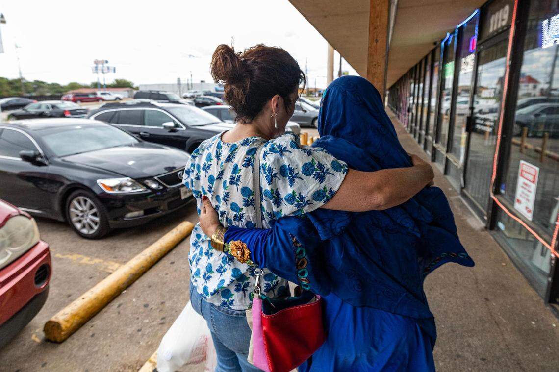 Angie Kraus, the founder of nonprofit Amshera, hugs Khatima Amini after getting groceries together at the Afghan Halal Market in Fort Worth. Kraus volunteers her time and money to assist Afghan refugees starting their new life in Fort Worth after they fled the country following the Taliban takeover in 2021.