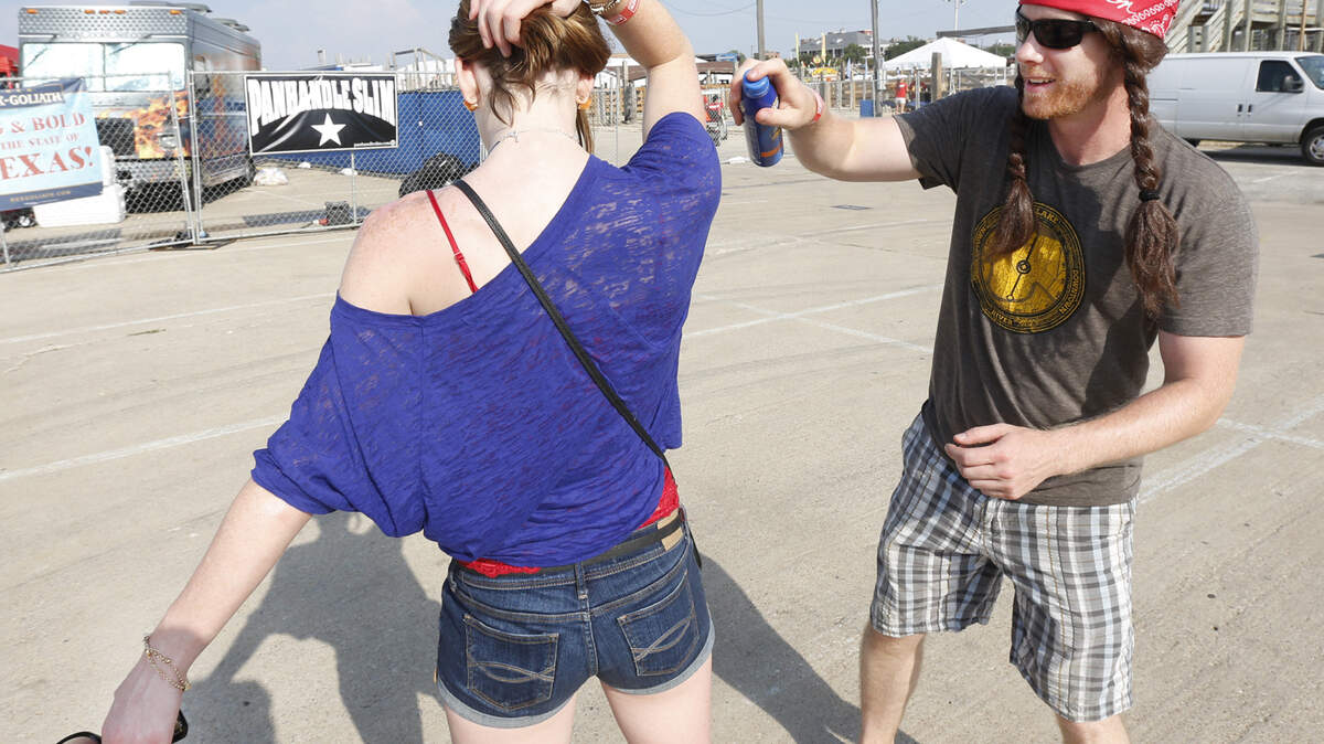 In summer, you need to make sure you are properly protecting your skin from the sun’s rays. Here, Sean Willie is doing so as he puts sunscreen on Hannah Thompson at Willie Nelson’s 4th of July Picnic at the Fort Worth Stockyards July 4, 2013. 2013.
