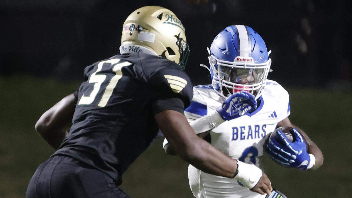 Birdville defensive end Chi Dumebi (51) zeros in on Brewer running back Kameron Coleman (9) during the first half of a UIL football game between Brewer and Birdville at Birdville FAAC Stadium in North Richland Hills, Texas, Friday, October, 17, 2025.