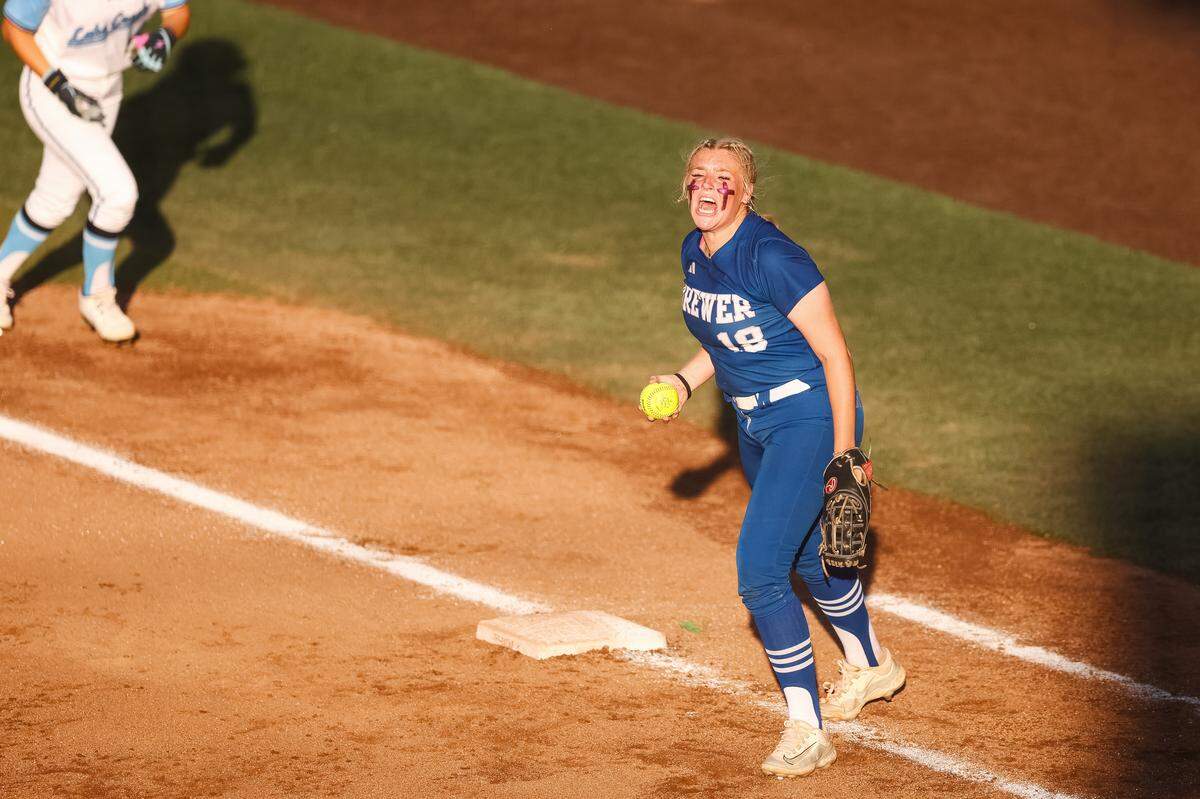 White Settlement Brewer first baseman Kamren Pride (18) screams in celebration after making a play at first against Montgomery Lake Creek in the UIL Class 5A Division II state softball championship game at Red & Charline McCombs field in Austin, Texas, on Friday, May 29, 2026.