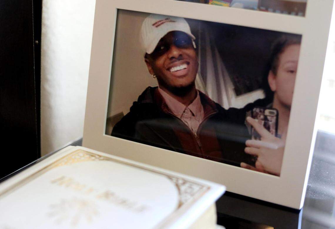 A photograph of Darius Tarver sits beside a Bible in the office of his father, Kevin Tarver.