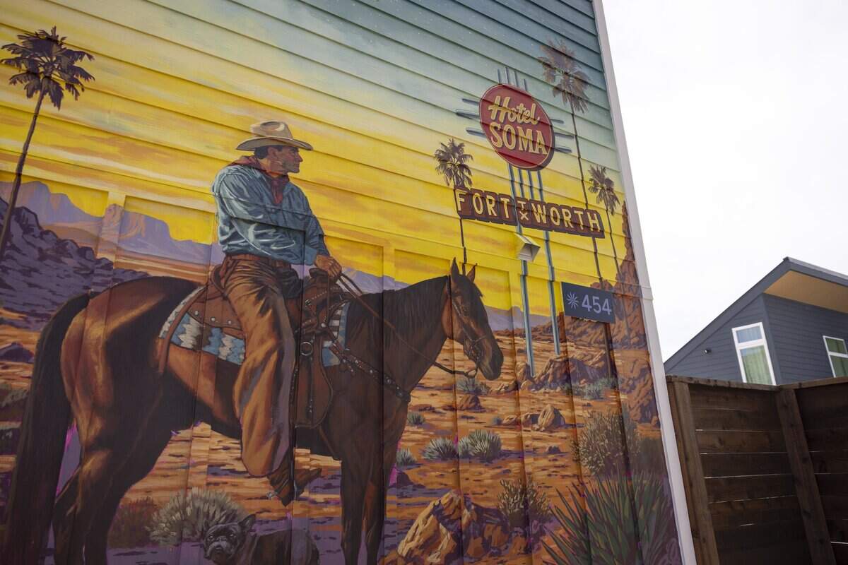 A mural representing Fort Worth is painted on one of the buildings at Hotel SOMA on Thursday, May 7, 2026 in Fort Worth, Texas. The hotel's casita villas feature artwork from local artists.