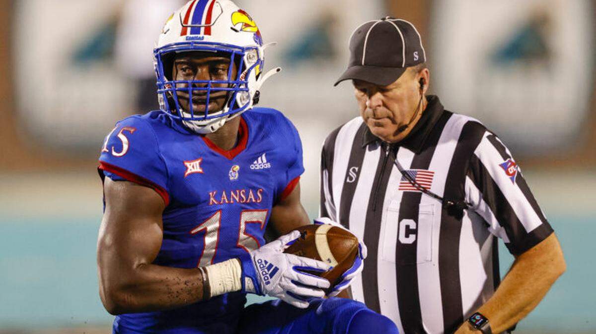Kansas defensive end/linebacker Kyron Johnson drew attention on the pre-draft circuit for his blazing speed. On Saturday, the Eagles picked him in the sixth round of the 2022 NFL Draft.