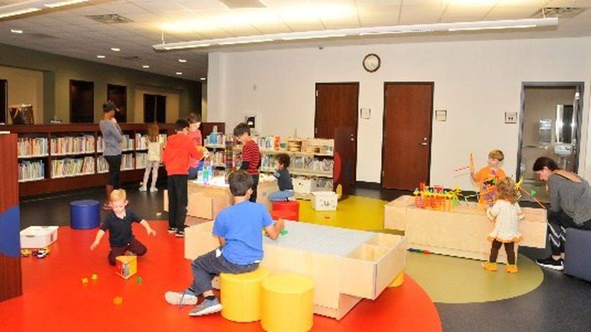 Youngsters enjoy the expanded children’s department at the Colleyville Public Library. The library began a spatial reconfiguration project in August that is expected to be finished in early December.