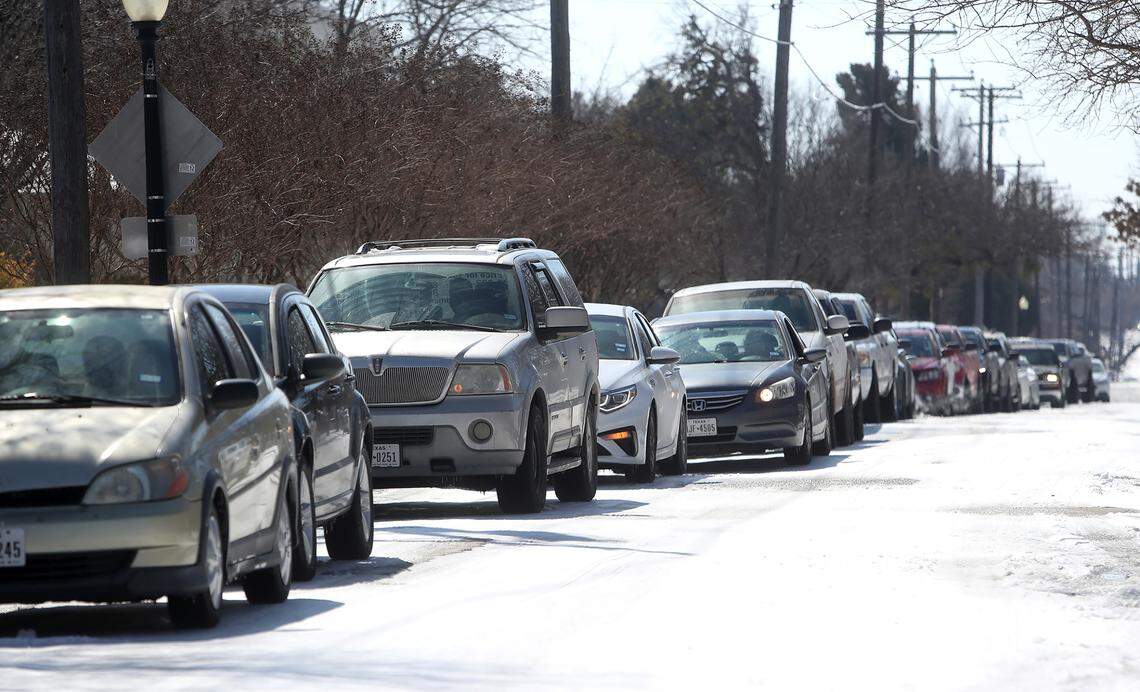 A line of cars wait in line for food during a food bank distribution by the Boys & Girls Clubs of Greater Tarrant County in partnership with Tarrant Area Food Bank on Friday, February 19, 2021.