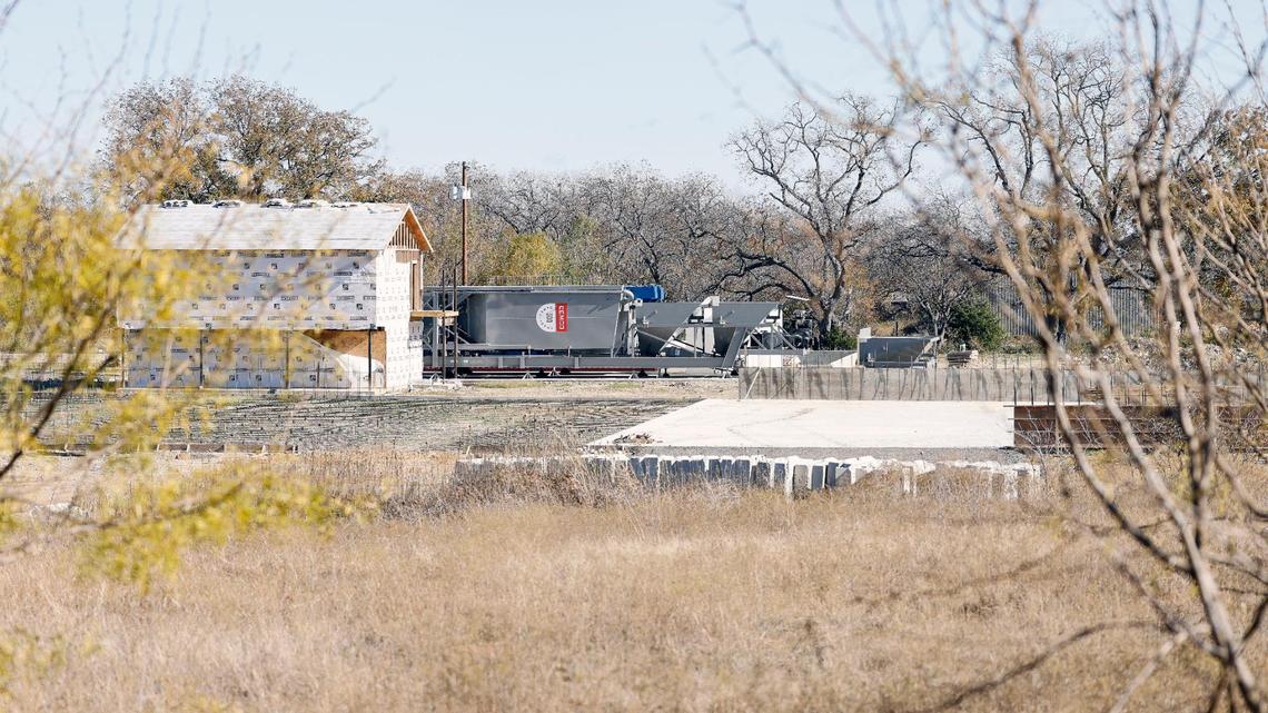 A batch concrete plant is waiting for permits to resume construction in Rendon. David Smith and his neighbors oppose the plant, which is about 200 yards from their backyards. 