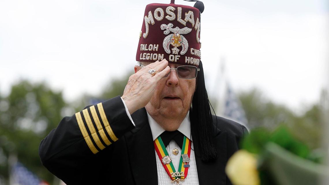 Moslah Col. Paul Sawyer salutes the wreath just laid during the 93rd Fort Worth Memorial Day Service at Mount Olivet Cemetery in Fort Worth on Monday. Sawyer was also a colonel in the Army.