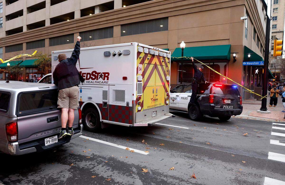 Barricade tape is lifted so a MedStar ambulance can reach the Sandman Signature Hotel in downtown Fort Worth where a powerful explosion occurred on Monday, January 8, 2024. At least 21 were injured in the explosion.