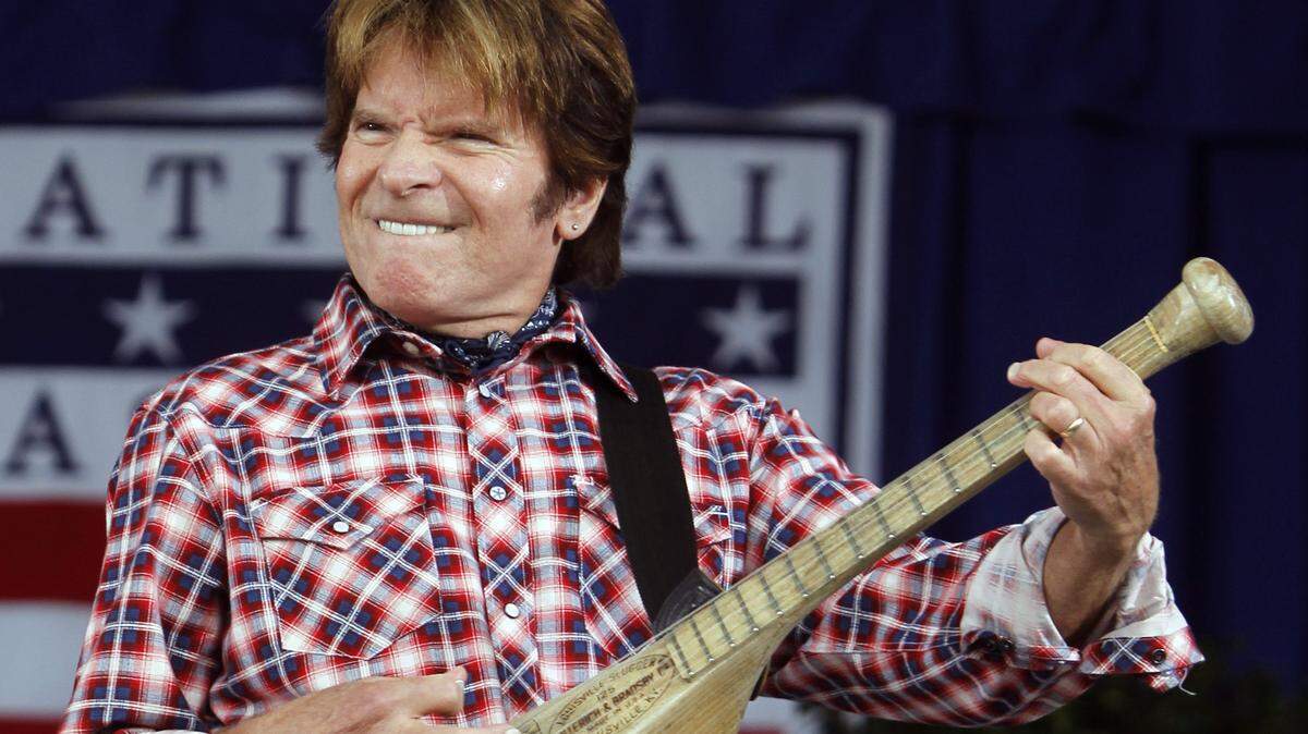 Singer John Fogerty performs “Centerfield” during the Baseball Hall of Fame induction ceremony in Cooperstown, N.Y., in 2010.