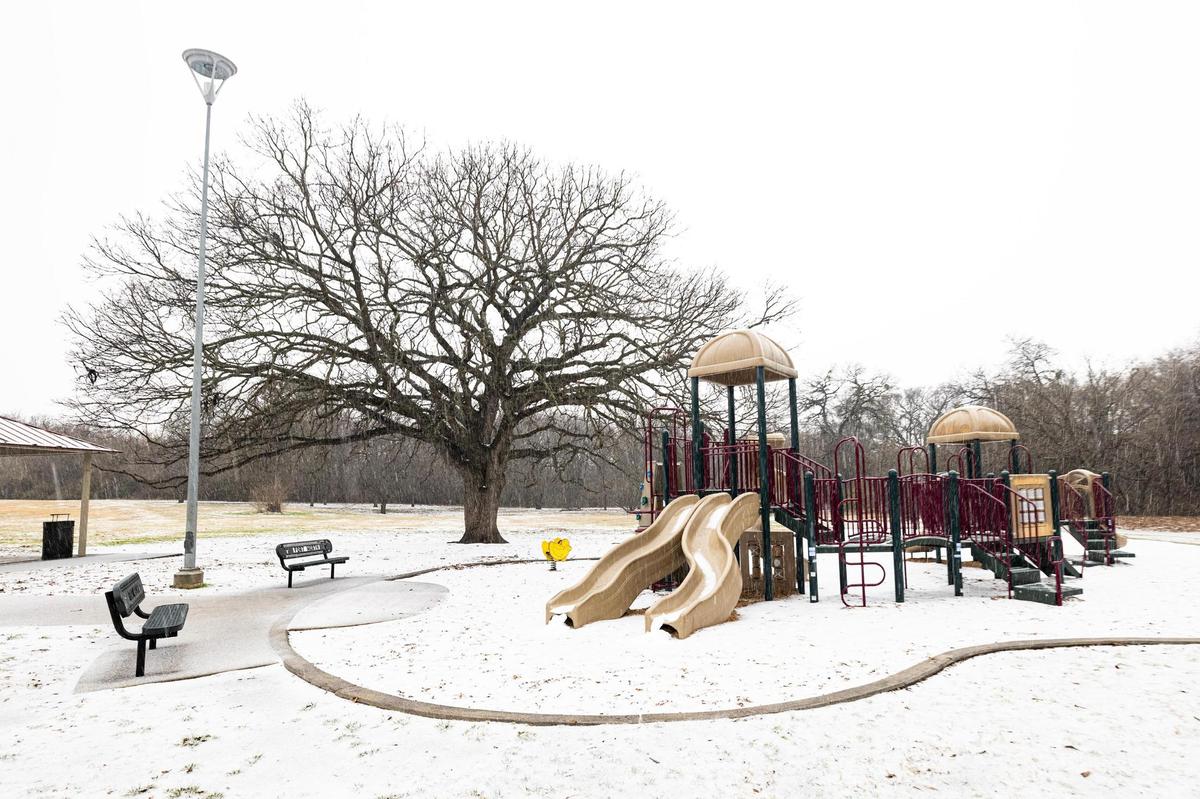 A playground is filled with snow at Oakmont Park in Fort Worth on Thursday, Jan. 9, 2025. A winter storm is expected to bring multiple inches of snow to the Dallas-Fort Worth metroplex for the next two days.