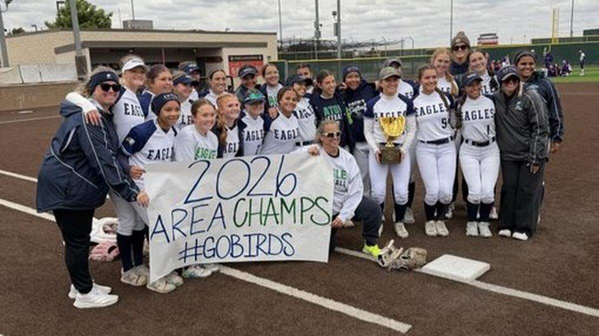 The Haslet Eaton softball team poses with hardware after defeating El Paso Eastlake in Game 2 to sweep their Class 6A Division I area-round series on Friday, May 1, 2026, at Lubbock-Cooper High School in Lubbock, Texas.