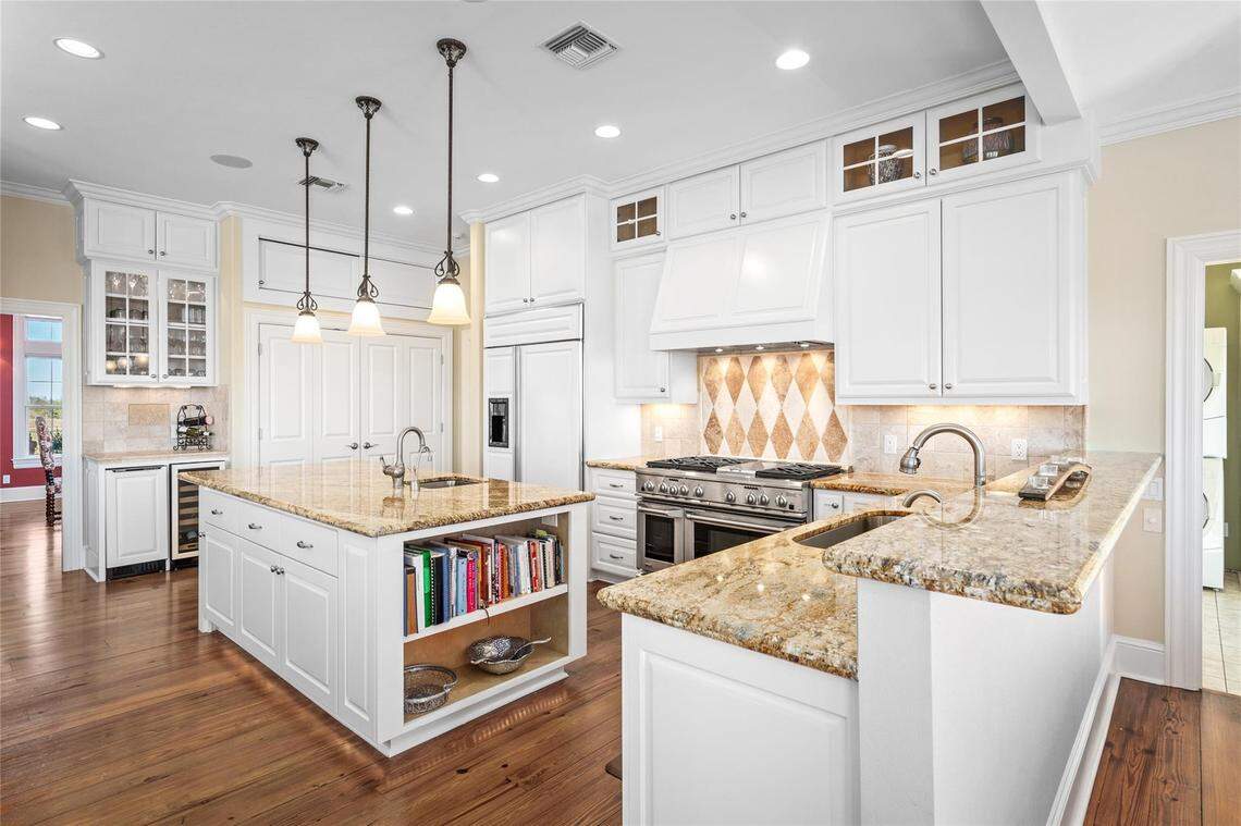 Storybook country living in a historical 60.7-acre property with a modern kitchen, an outdoor poolside oasis, a barn and wide-open panoramic views in Brenham, Texas.