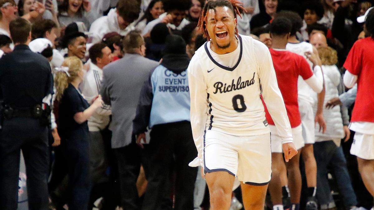 Richland point guard CJ Nelson (0) reacts after the Royals won a high school 5A Region 1Area Round playoff basketball game at UTA College Park Center in Arlington, Texas, Friday, Feb. 25, 2022. Richland defeated Seguin 68-49. (Special to the Star-Telegram Bob Booth)