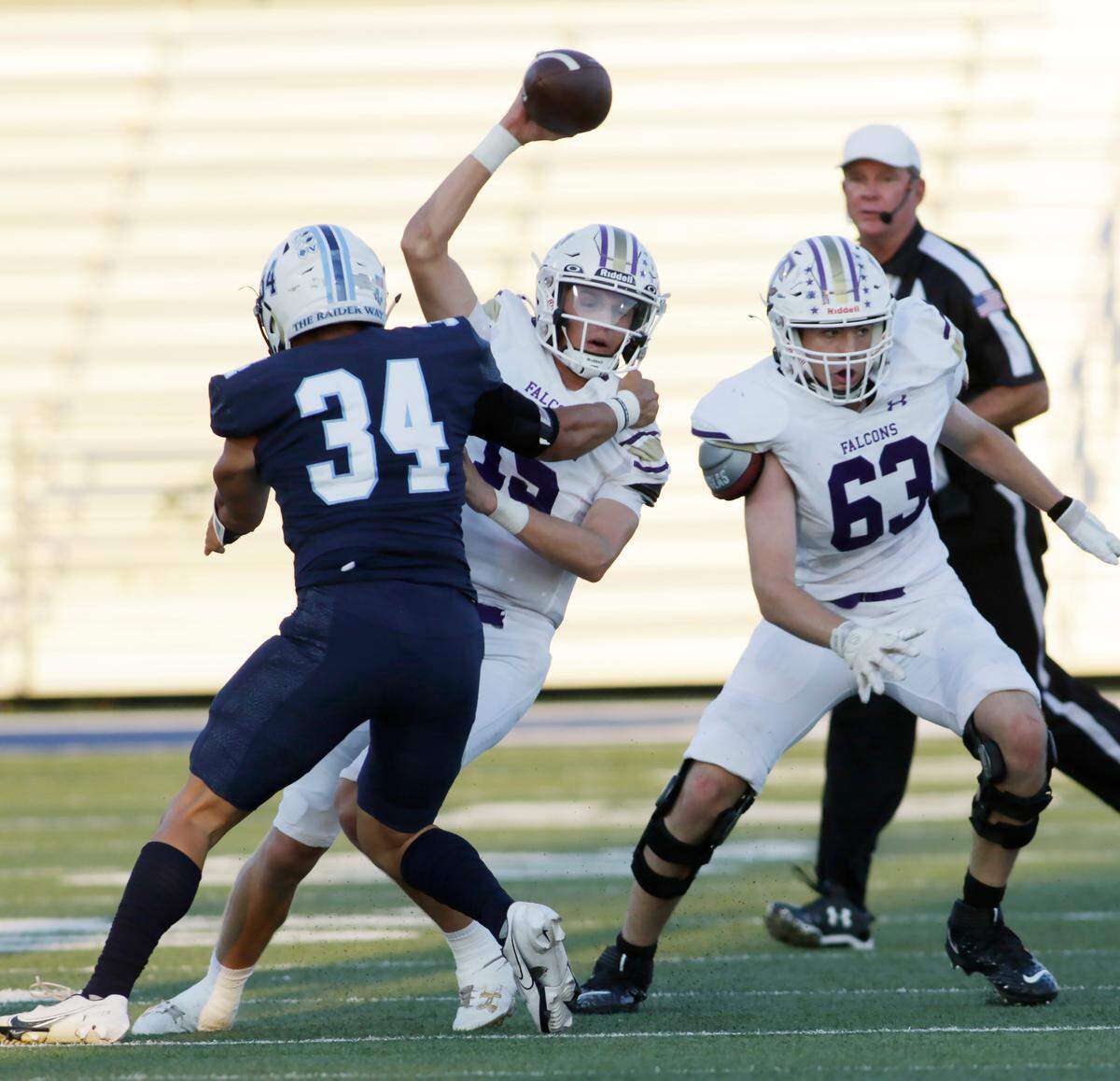 Timber Creek’s Carson Porter escapes the rush of the L.D. Bell defense during its UIL football game Friday night at Pennington Field in Hurst on Friday Sept. 6, 2024.