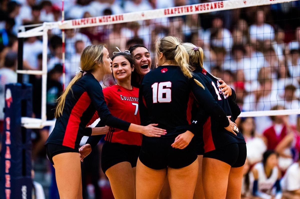 Colleyville Heritage celebrates a point in set 1 in a district match against Grapevine at Grapevine High School on October 4th 2022.
