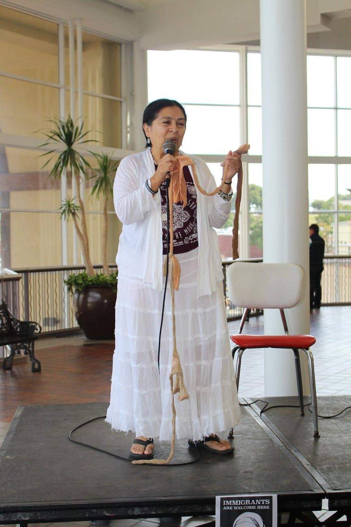 Tammy Gomez reads her poems at the 100 Thousand Poets for Change event in South Fort Worth on Sept. 30, 2017. She began visiting the Seminary branch of the Fort Worth Library at age 5 and later found it to be a good place to read, research, and write school assignments