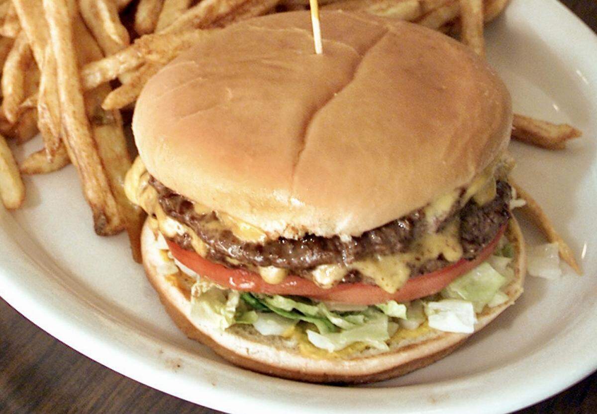 A double cheeseburger with french fries from Al’s Hamburgers in Arlington.