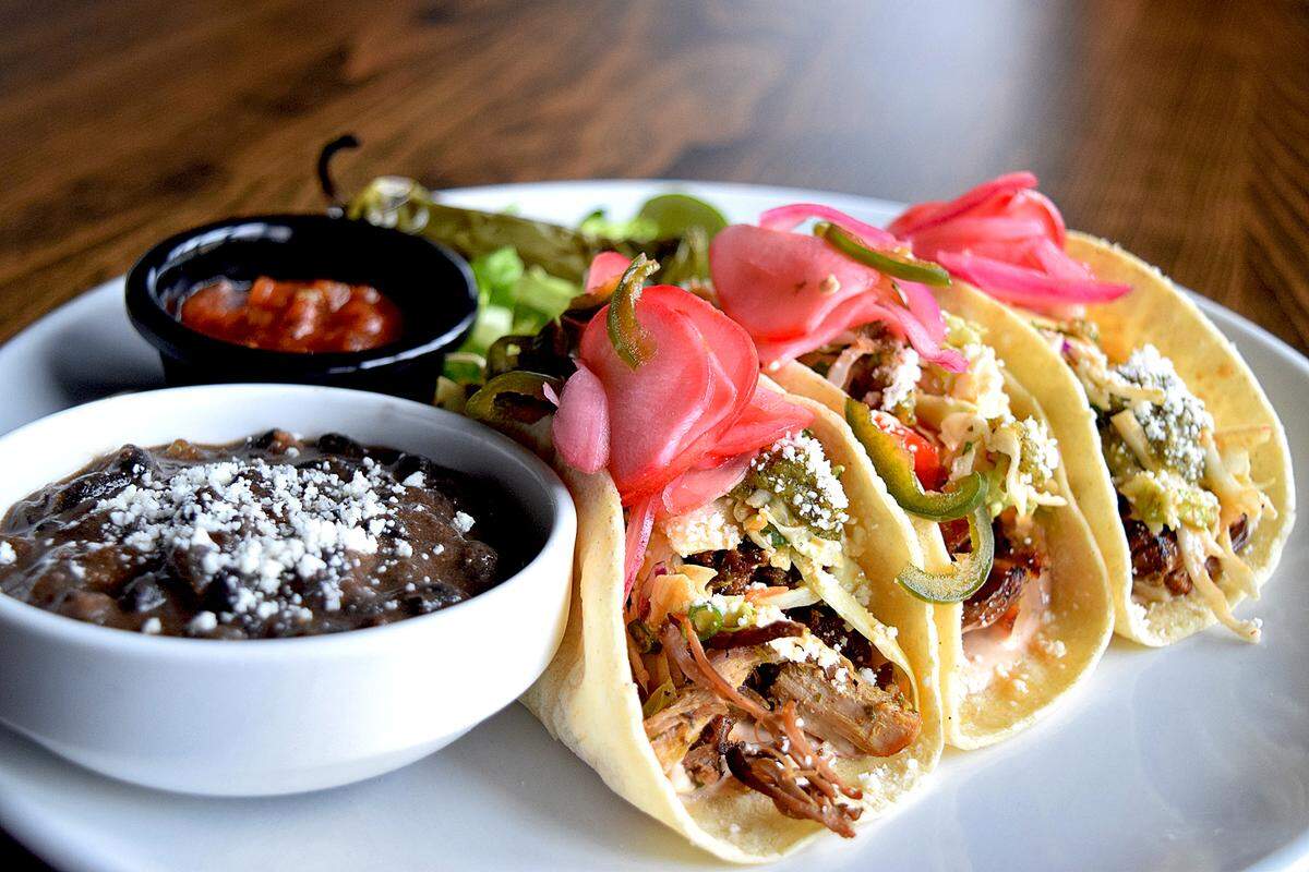 Pork carnitas tacos from the sprawling, eclectic menu at Thirsty Lion Gastropub & Grill, which opened a Euless location in December in Glade Parks.