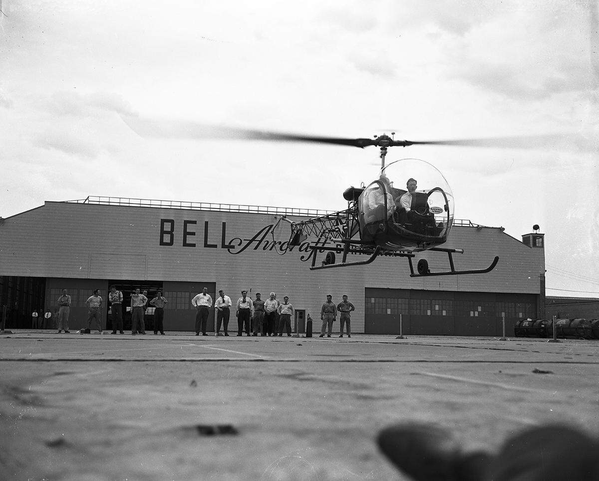 On April 20, 1951, the first production helicopter ever assembled in Texas lifted off the ground when this Bell Aircraft HTL-4, Navy rescue craft, rose from the ramp at Bell’s No. 1 plant on Blue Mound Road. The test pilot was Bill Quinlan, right, accompanied by Del Reed, inspector, both of Bell’s Niagara Falls plant.