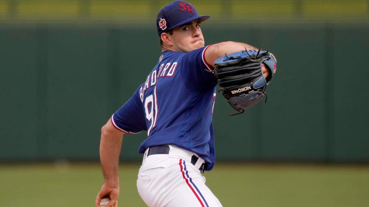 Texas Rangers starting pitcher Cody Bradford throws during the first inning of a spring training baseball game against the Colorado Rockies Tuesday, Feb. 28, 2023, in Surprise, Ariz. (AP Photo/Charlie Riedel)