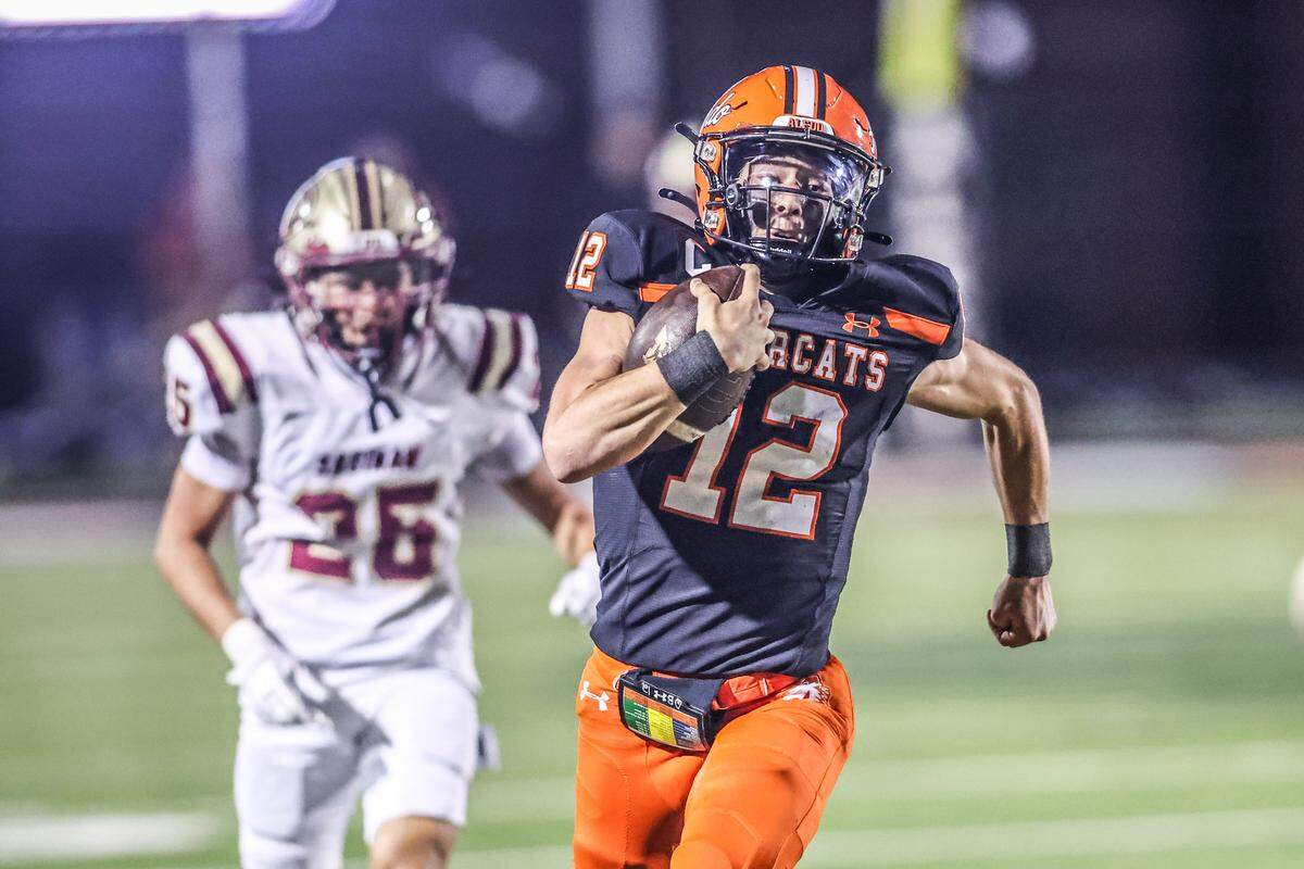 Aledo quarterback Lincoln Tubbs (12) has a long run late in the second quarter against Saginaw in a Class 5A Division I bi-district playoff game on Thursday, November 13, 2025 at Tim Buchanan Stadium in Aledo, Texas.