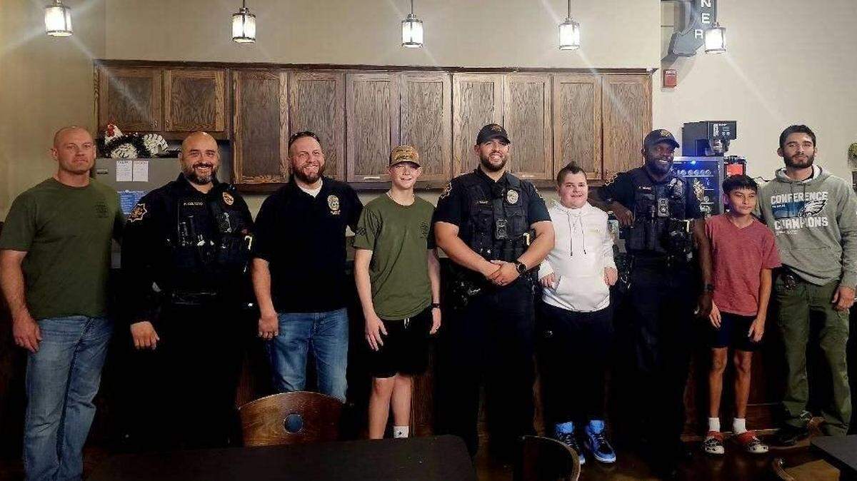 Officers with the Grapevine Police department and students at the first Operation Game Time.