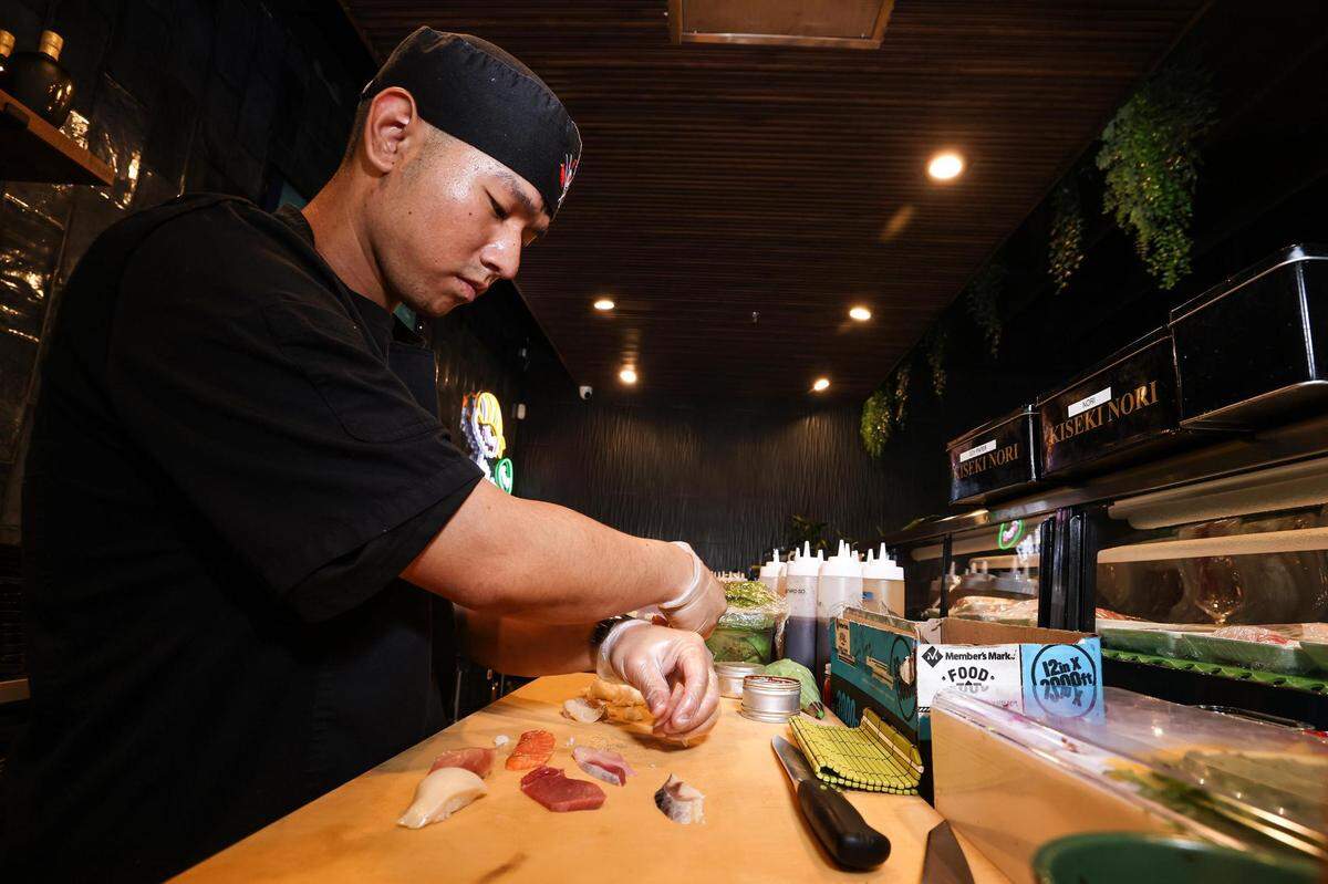 Sushi chef John Thuang assembles a nigiri sampler at Hush Sushi, Kitchen and Bar in Keller, Texas on Thursday, Aug. 24, 2023.