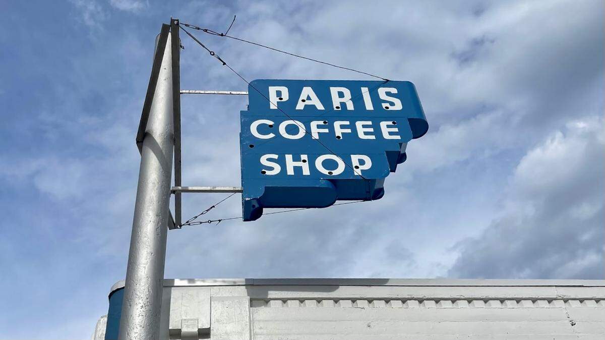 The Paris Coffee Shop sign, repainted for new owners Lou Lambert and staff.