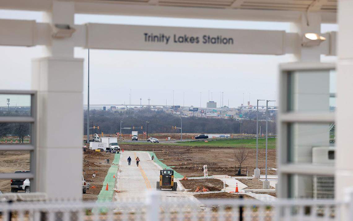 Crews work to prepare the new Trinity Lakes Station for operation on Friday, February 16, 2024. The station, which will open on Feb. 19, is a new stop on the Trinity Railway Express commuter rail between Dallas and Fort Worth.