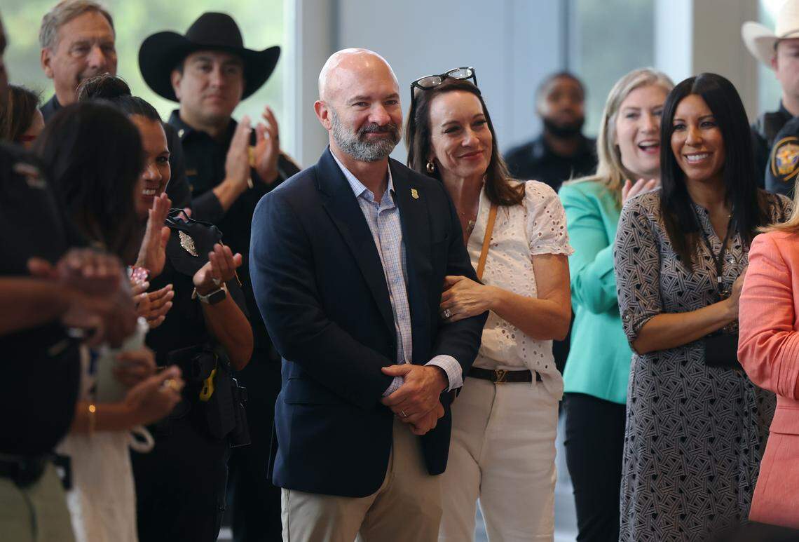 Former Fort Worth Police Chief Neil Noakes and his wife are recognized during a press conference to announce the new chief on Friday, Aug. 22, 2025, at City Hall. Eddie Garcia, the former Dallas chief, was named as Noakes successor.