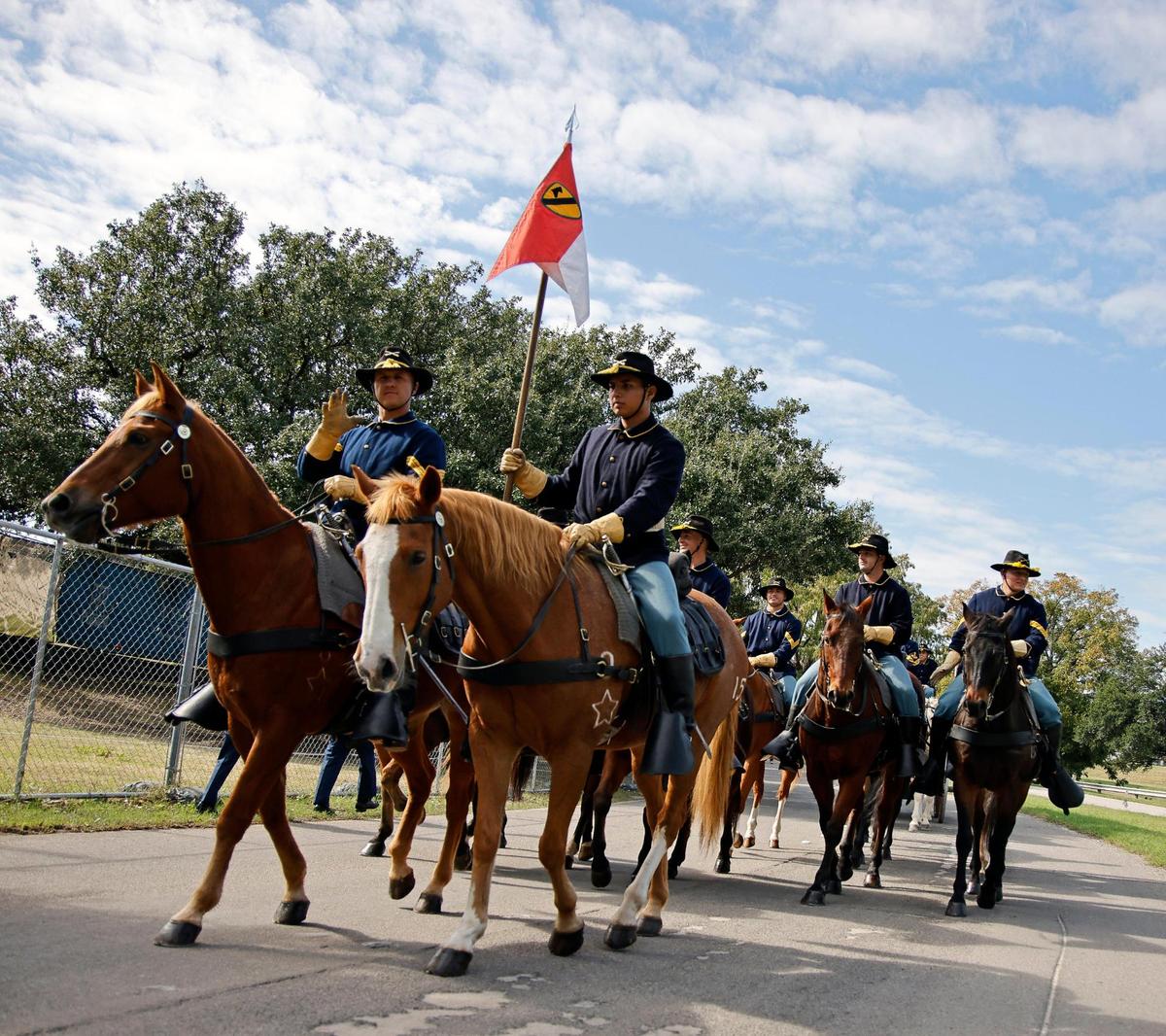 The 1st Team Cavalry Division Horse Detachment from Fort Cavazos marches down Belknap Street.