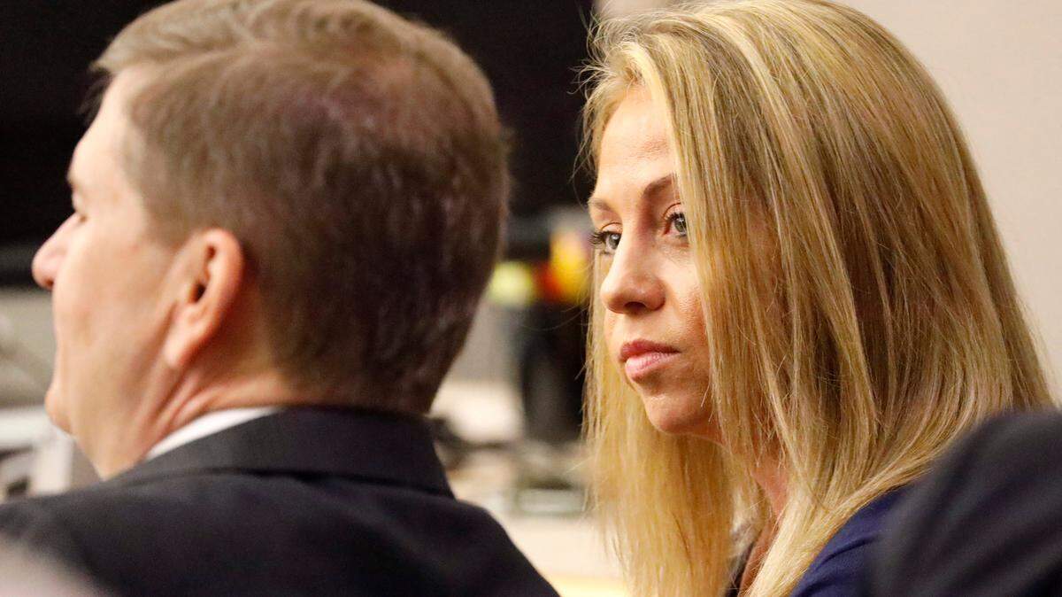 Fired Dallas police officer Amber Guyger looks toward her attorney before proceedings in her murder trial on Sept. 25, 2019, in Dallas. Guyger was accused of shooting her unarmed neighbor, Botham Jean, in his Dallas apartment.