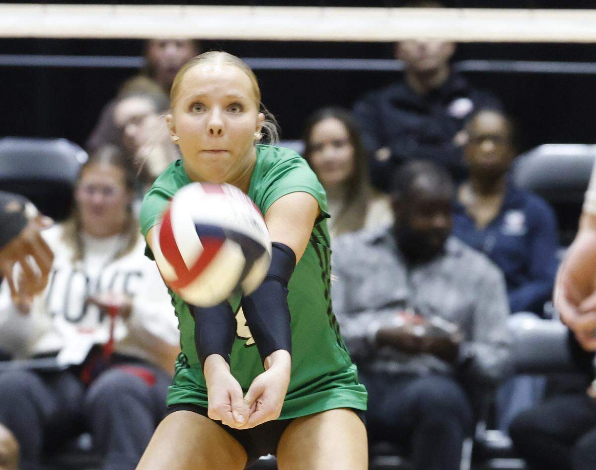 Southlake Carroll defensive specialist Collins Alonzo (4) sets the ball against Austin during the first set of the UIL Class 6A Division II state volleyball championship game Saturday Nov. 22, 2025 at Curtis Culwell Center in Garland, Texas.