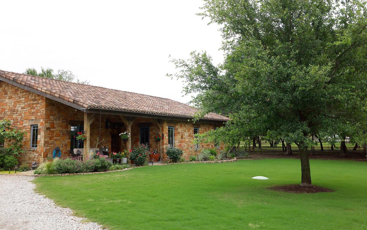 One of two guest homes on the Lazy H Ranch, a 50-acre property in Fort Worth. The main home has 5 bedrooms and 6.5 bathrooms as well as an infinity-edge pool. There is also an eight-stall stable, two guest houses and a ranch-hand house.