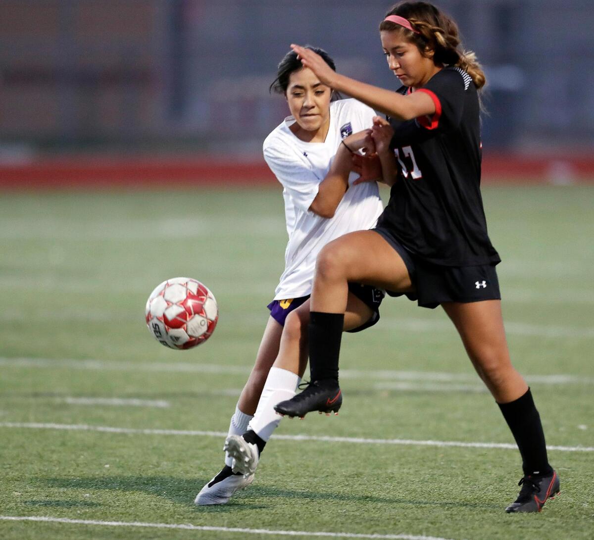 Everman’s Arely Vazquez (10) and Legacy’s Pricilla Perez (17) collide while going for the ball during a district 8-5A high school soccer game at Mansfield Legacy High School in Mansfield, Texas, Wednesday, March 03, 2021. Legacy defeated Everman 8-0. (Special to the Star-Telegram Bob Booth)