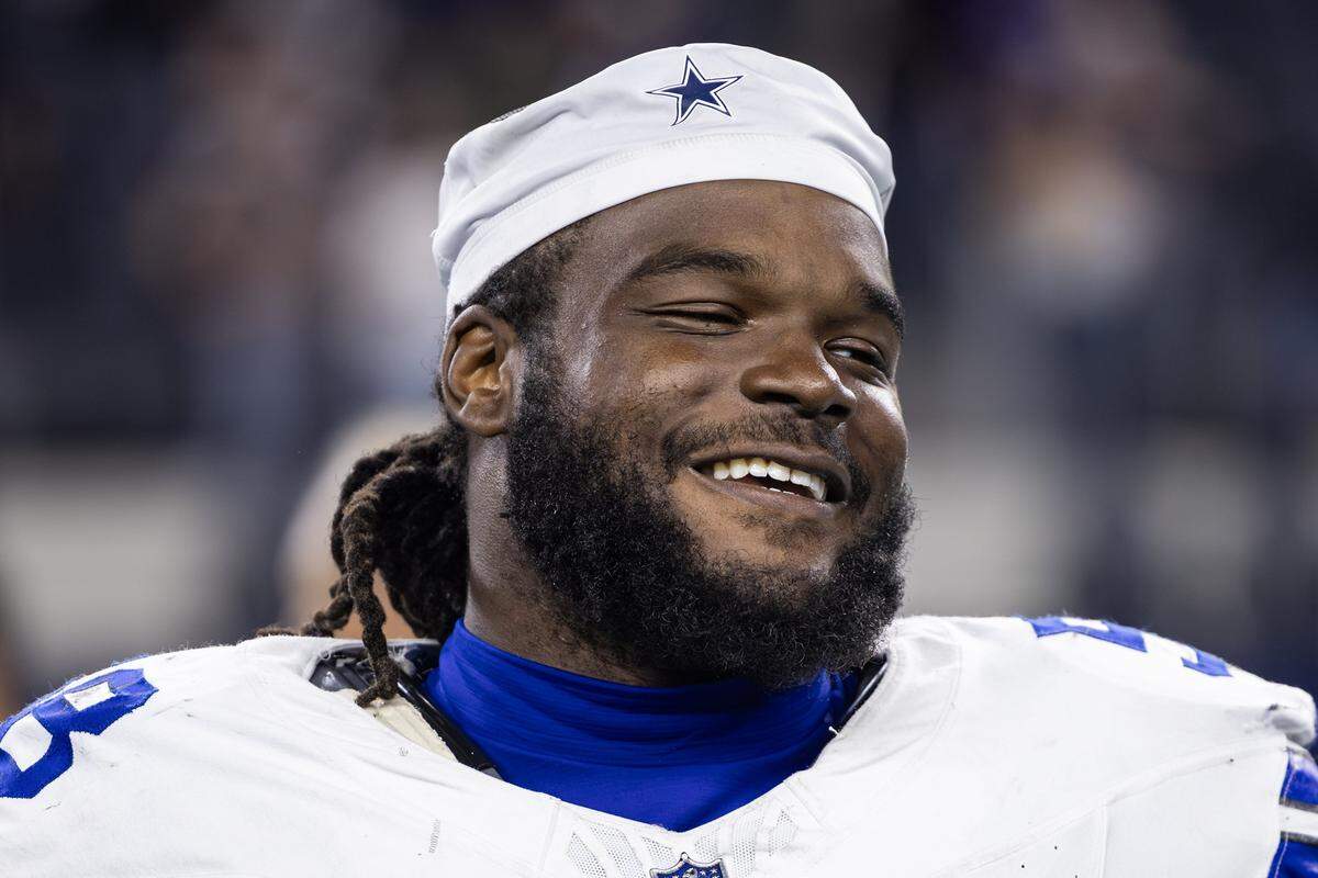 Cowboys defensive tackle Mazi Smith (58) shares a laugh with his teammates after an NFL preseason game between the Dallas Cowboys and the Baltimore Ravens at AT&T Stadium in Arlington on Saturday, Aug. 16, 2025,
