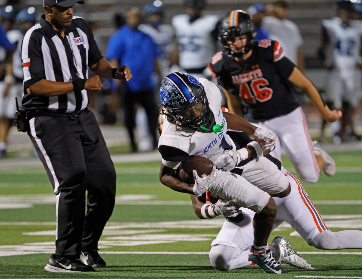 North Crowley running back Cornelius Warren (1) is tripped up after a short gain during a UIL 6A Conference football game at Wilkerson-Sanders Memorial Stadium in Rockwall Texas, Thursday, Sept. 19, 2024.